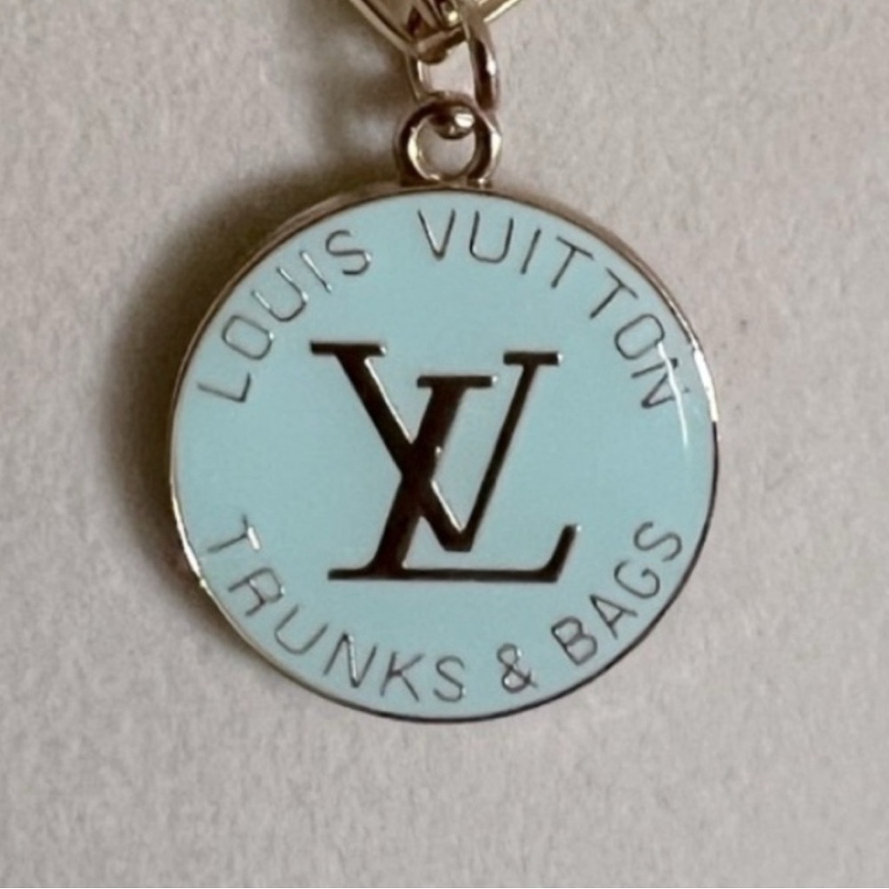 Set 2 Pc. Louis Vuitton Teal/Gold Logo Tag & 17” Gold chain w/lobster claw clasp